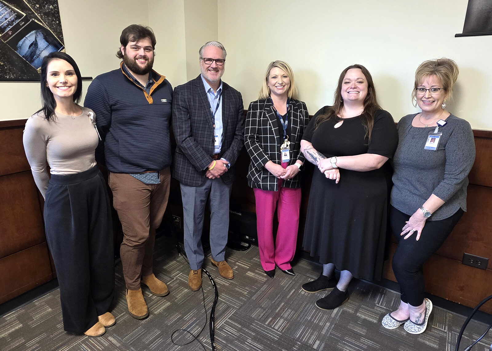 Members of the Mission Health staff pose with Alex McCurry (second from left, recipient of the LPN scholarship from Mission Health) and Brittany Kirby (second from right, recipient of the RN  scholarship)