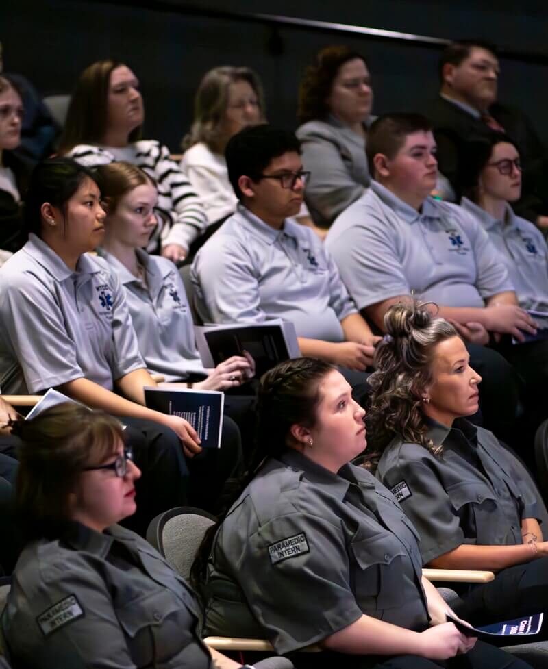 Students listening to speakers