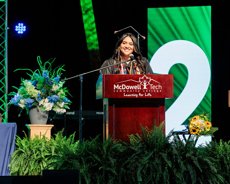 Valedictorian graduate speaking at the ceremony