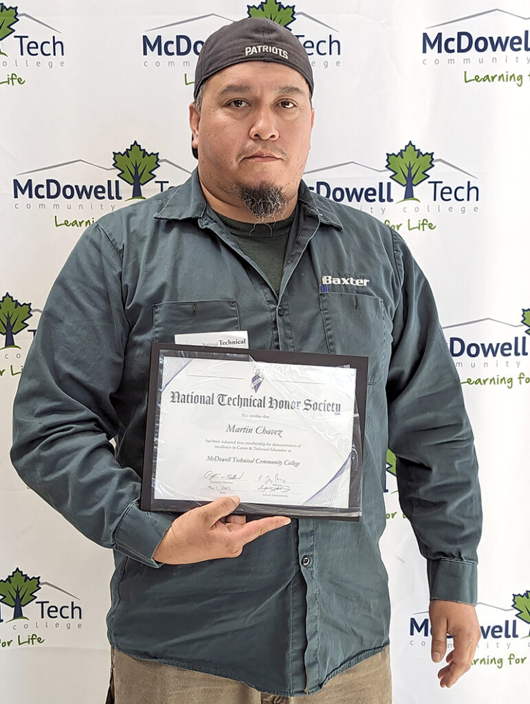 Martin Chavez holding his NTFS Certificate