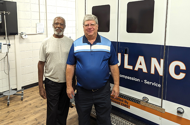 Dr. Edward S. Bernard with Eugene Edwards in front of McDowell Tech Ambulance