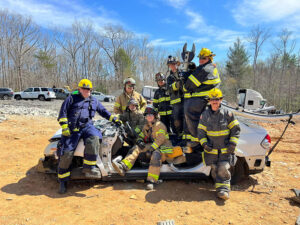 Students in a vehicle extrication class at McDowell Fire, Rescue and EMS College pose during a brief break in training. During an automobile accident, the expertise these students are gaining in using equipment like the "jaws of life" may make the difference between life and death for individuals pinned in a vehicle with life-threatening injuries.